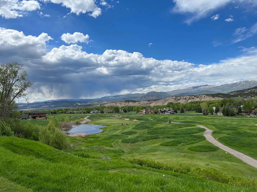 Panoramic view of a lush green golf course at Eagle Ranch Golf Course. Smooth