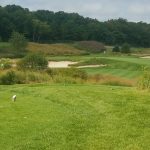 Panoramic view of a lush green golf course at Eagle Ridge Golf Club. Smooth