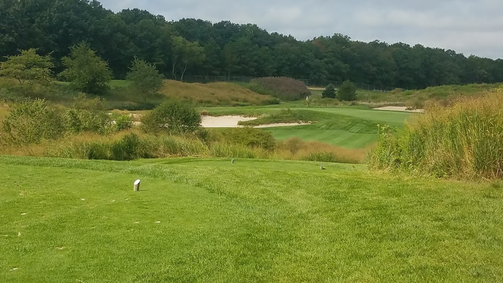 Panoramic view of a lush green golf course at Eagle Ridge Golf Club. Smooth