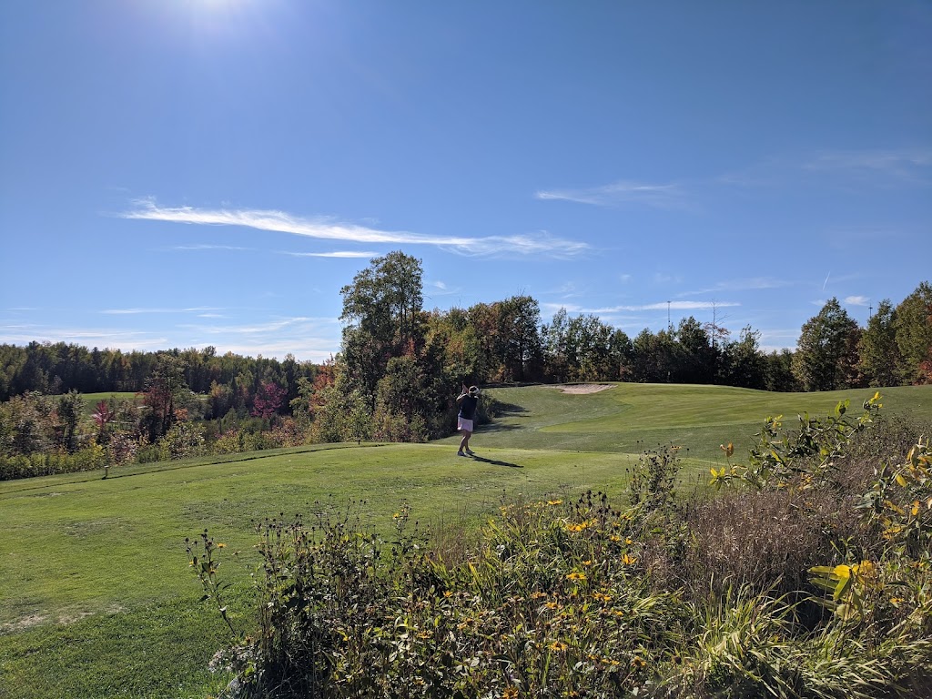 Panoramic view of a lush green golf course at Eagle Ridge Golf Course. Smooth