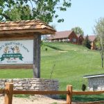 Panoramic view of a lush green golf course at Eagles Bluff Golf Course. Smooth