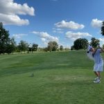 Panoramic view of a lush green golf course at Eagles' Landing Golf Course. Smooth