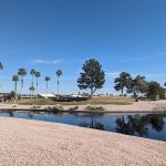 Panoramic view of a lush green golf course at Eagle's Nest Golf Club. Smooth