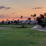 Panoramic view of a lush green golf course at Eagle's Nest Golf Club. Smooth