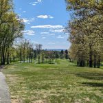 Panoramic view of a lush green golf course at East Hartford Golf Club. Smooth