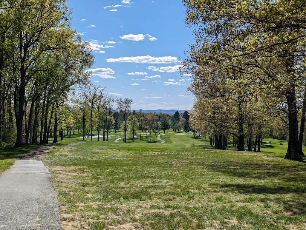 Panoramic view of a lush green golf course at East Hartford Golf Club. Smooth