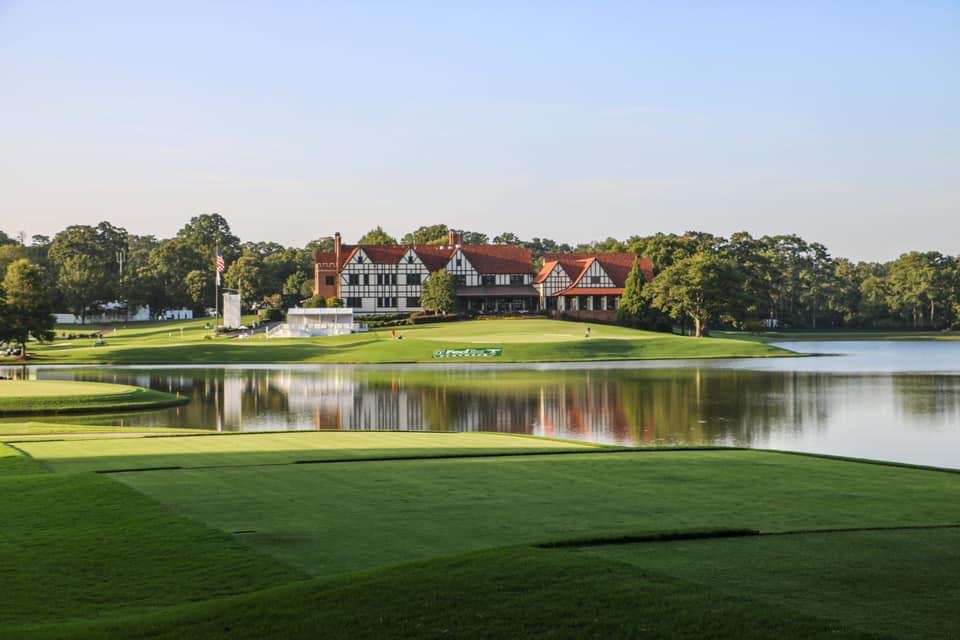 Panoramic view of a lush green golf course at East Lake Golf Club. Smooth