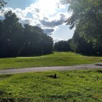 Panoramic view of a lush green golf course at East Mountain Golf Course. Smooth