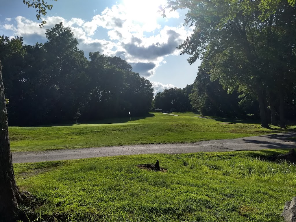 Panoramic view of a lush green golf course at East Mountain Golf Course. Smooth