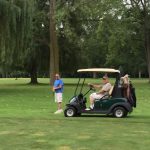 green grass with the flag in the hole.