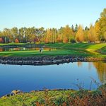 Panoramic view of a lush green golf course at Echo Falls Golf Club. Smooth