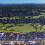 Panoramic view of a lush green golf course at Echo Mesa Golf Course. Smooth