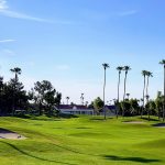 Panoramic view of a lush green golf course at Echo Mesa Golf Course. Smooth