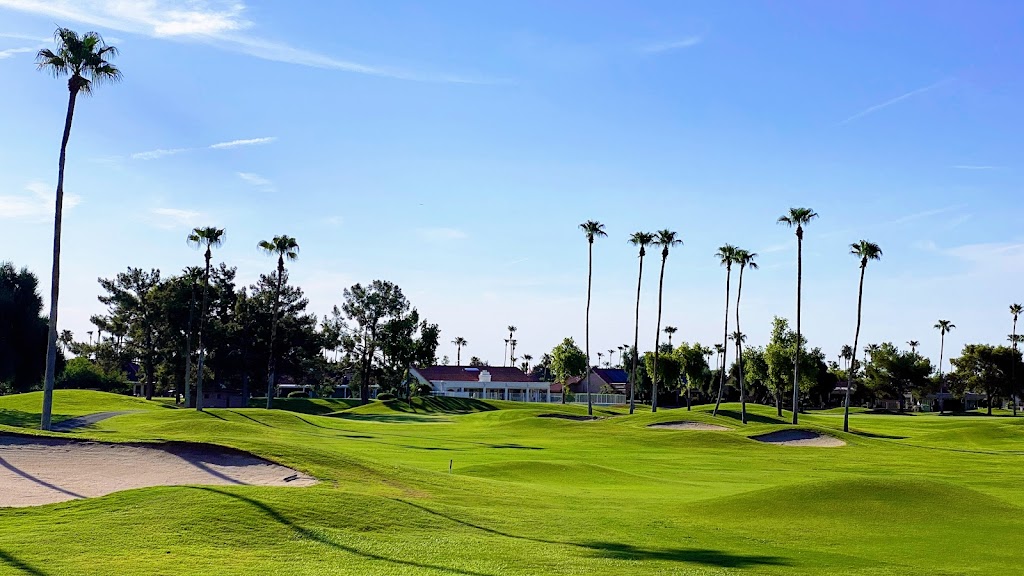 Panoramic view of a lush green golf course at Echo Mesa Golf Course. Smooth