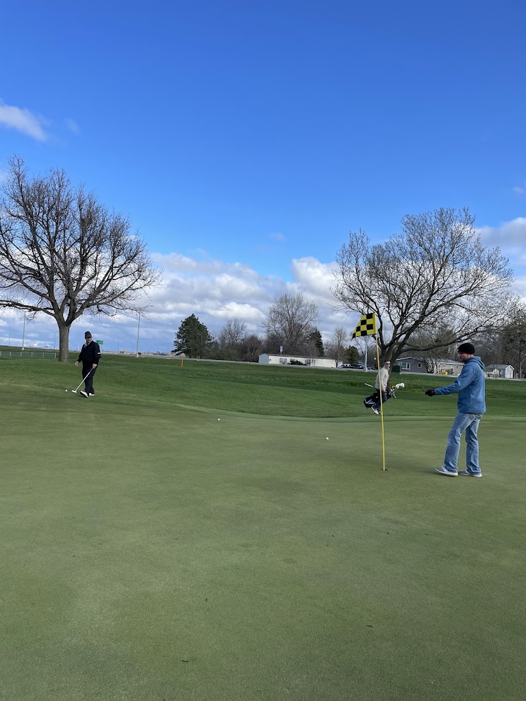 Panoramic view of a lush green golf course at Edgebrook Golf Course. Smooth