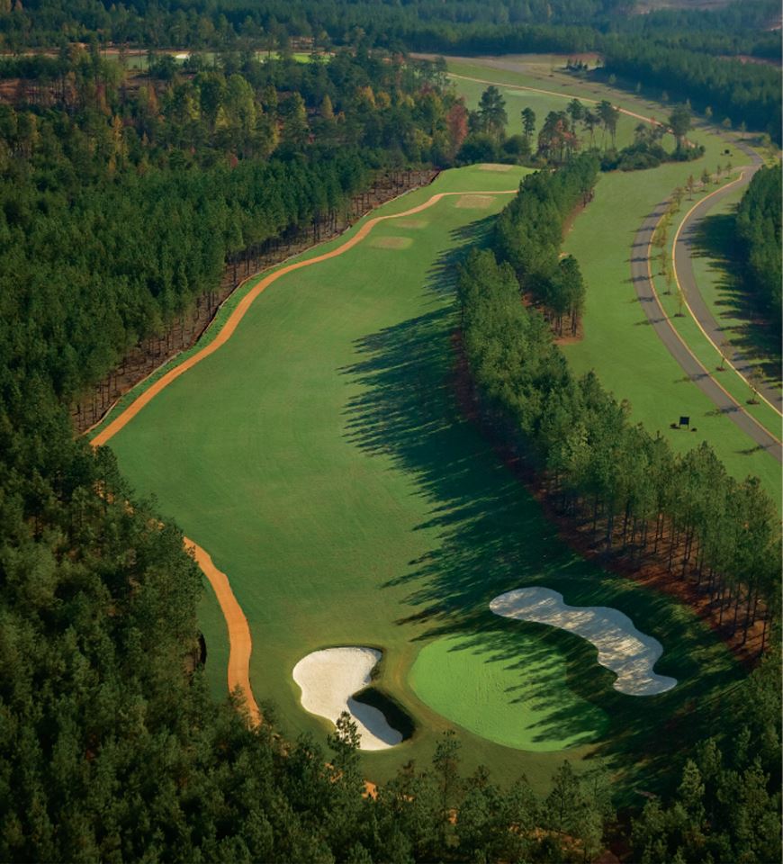 Panoramic view of a lush green golf course at Edgewater Golf Club. Smooth
