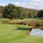 Panoramic view of a lush green golf course at Edgewood Country Club. Smooth