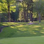 Panoramic view of a lush green golf course at Edgewood Golf Course. Smooth