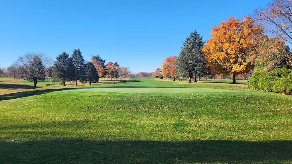 Panoramic view of a lush green golf course at Eel River Golf Course. Smooth