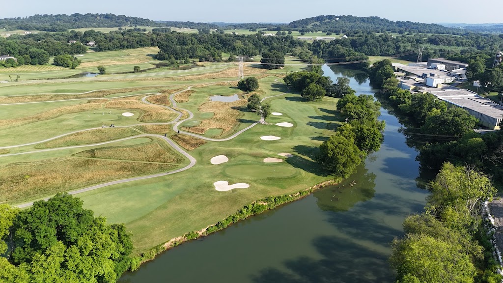 Panoramic view of a lush green golf course at Egwani Farms Golf Course. Smooth