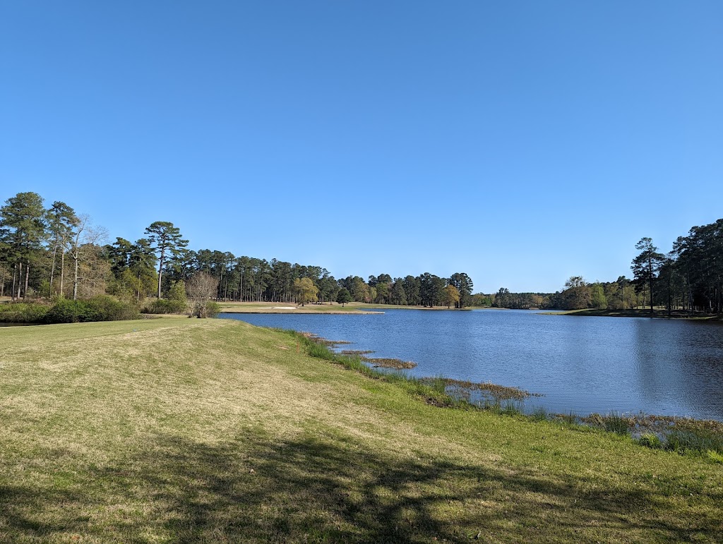 Panoramic view of a lush green golf course at Eisenhower Lakes Golf Club. Smooth