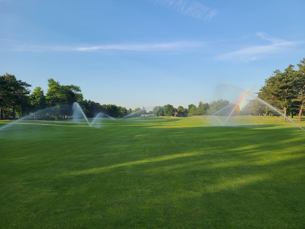 Panoramic view of a lush green golf course at Eisenhower Park Golf Courses. Smooth