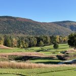 Panoramic view of a lush green golf course at Ekwanok Country Club. Smooth