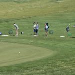Panoramic view of a lush green golf course at El Zagal Par 3 Golf Course. Smooth