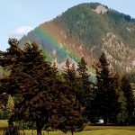 Panoramic view of a lush green golf course at Elk Ridge Golf Course. Smooth