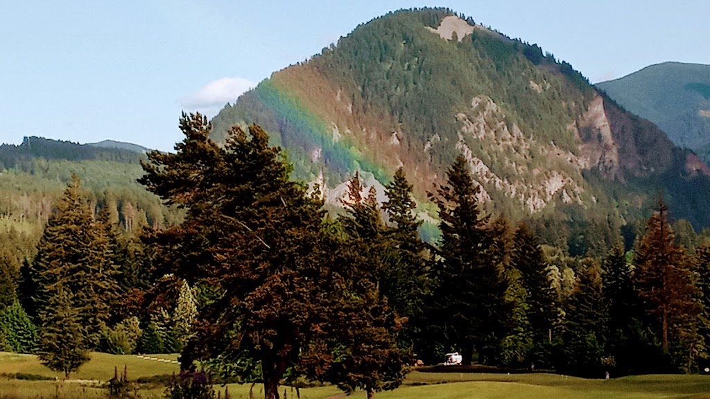 Panoramic view of a lush green golf course at Elk Ridge Golf Course. Smooth