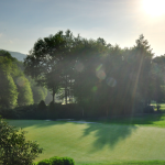 Panoramic view of a lush green golf course at Elk River Club. Smooth