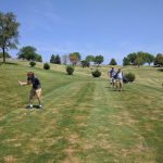 Panoramic view of a lush green golf course at Elkhorn Ridge Golf Course. Smooth