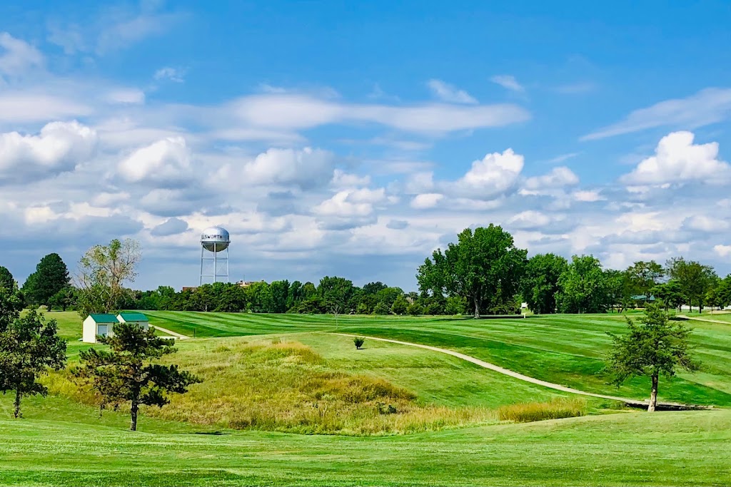 Panoramic view of a lush green golf course at Ellsworth Golf Course. Smooth