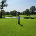 green grass with the flag in the hole.