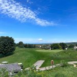Panoramic view of a lush green golf course at Elmbrook Golf Course. Smooth