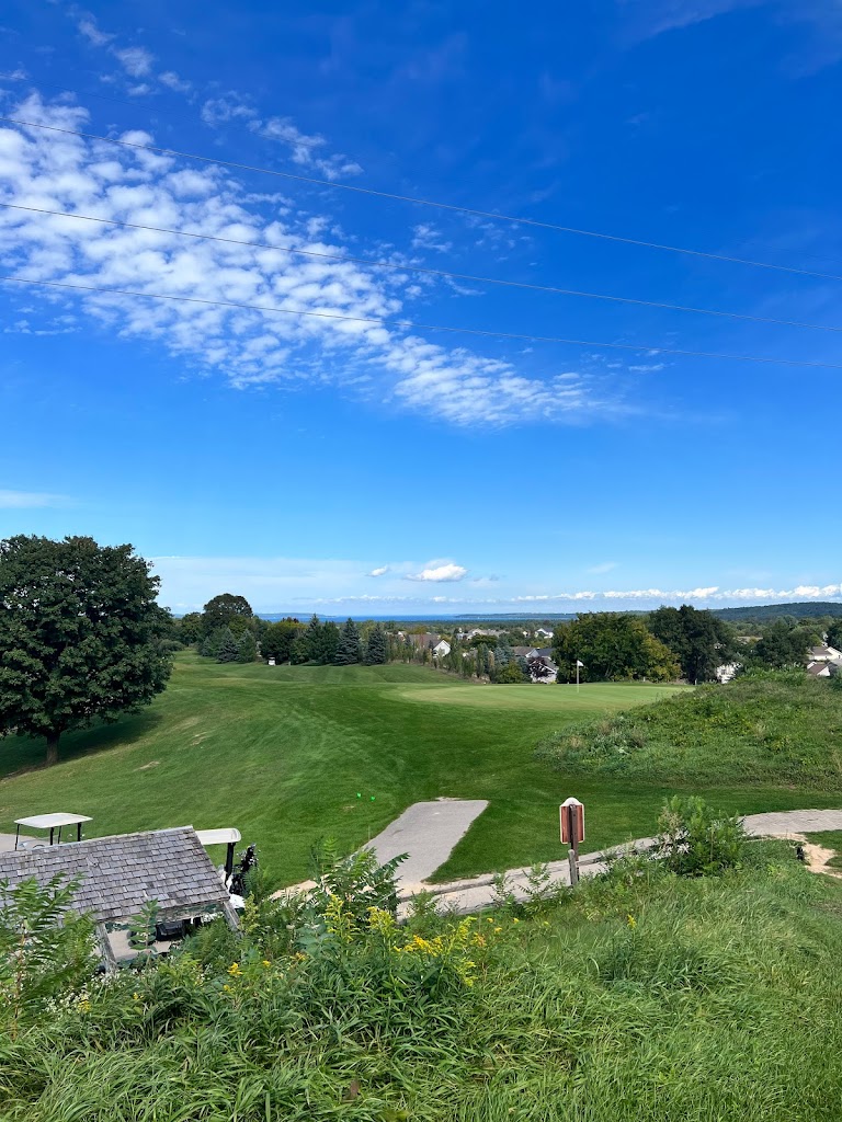 Panoramic view of a lush green golf course at Elmbrook Golf Course. Smooth