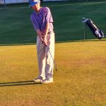 green grass with the flag in the hole.