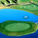 Panoramic view of a lush green golf course at Emerald Greens Golf Course. Smooth