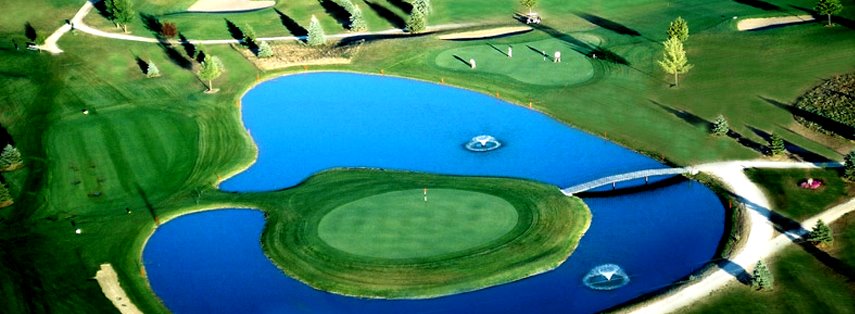 Panoramic view of a lush green golf course at Emerald Greens Golf Course. Smooth