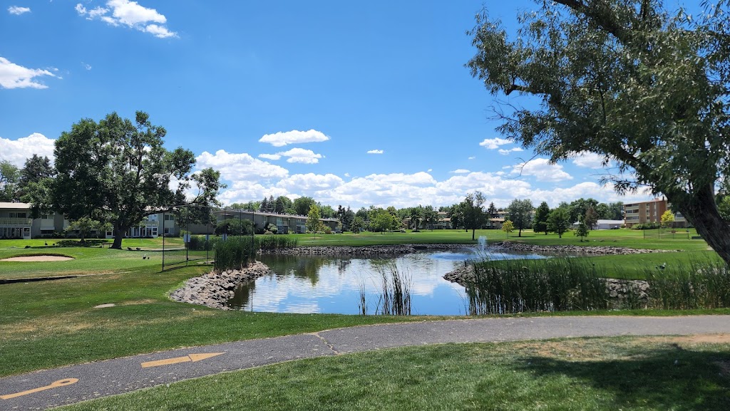 Panoramic view of a lush green golf course at Emerald Greens Golf Course. Smooth