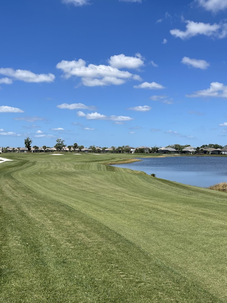 Panoramic view of a lush green golf course at Esplanade at Azario Lakewood Ranch Golf Course. Smooth