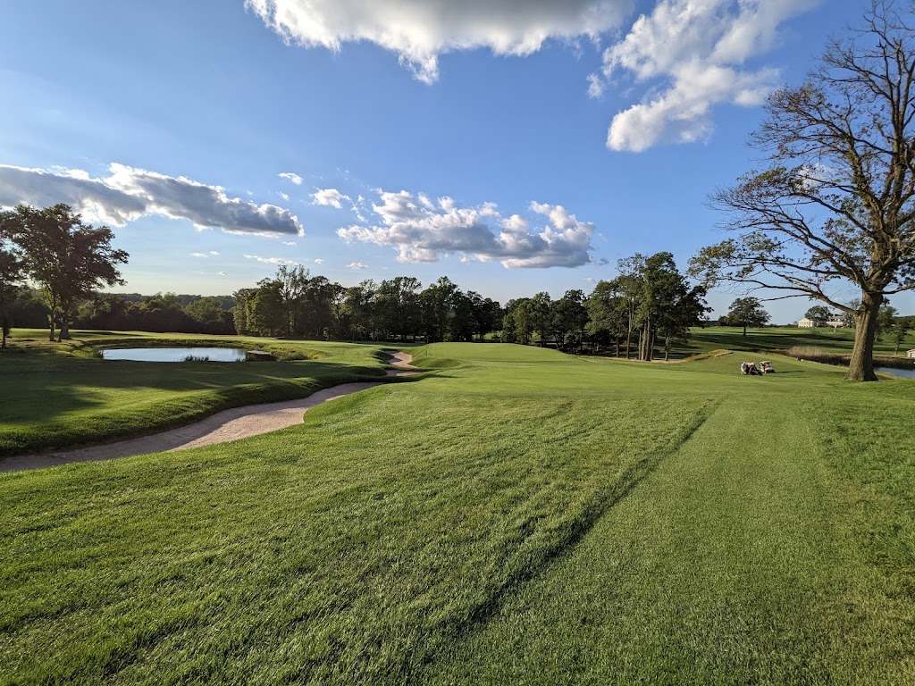 Panoramic view of a lush green golf course at Essex County Country Club. Smooth