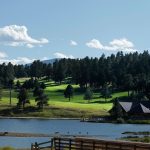 Panoramic view of a lush green golf course at Evergreen Golf Course. Smooth