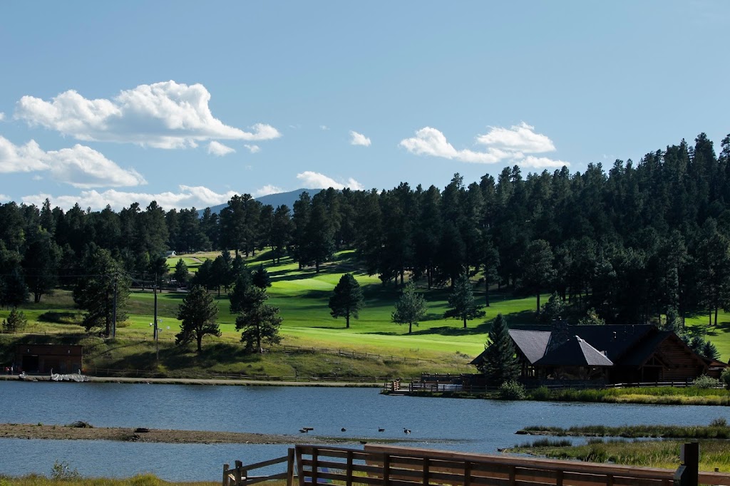 Panoramic view of a lush green golf course at Evergreen Golf Course. Smooth