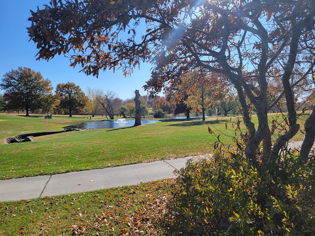 Panoramic view of a lush green golf course at Excelsior Springs Golf Club. Smooth