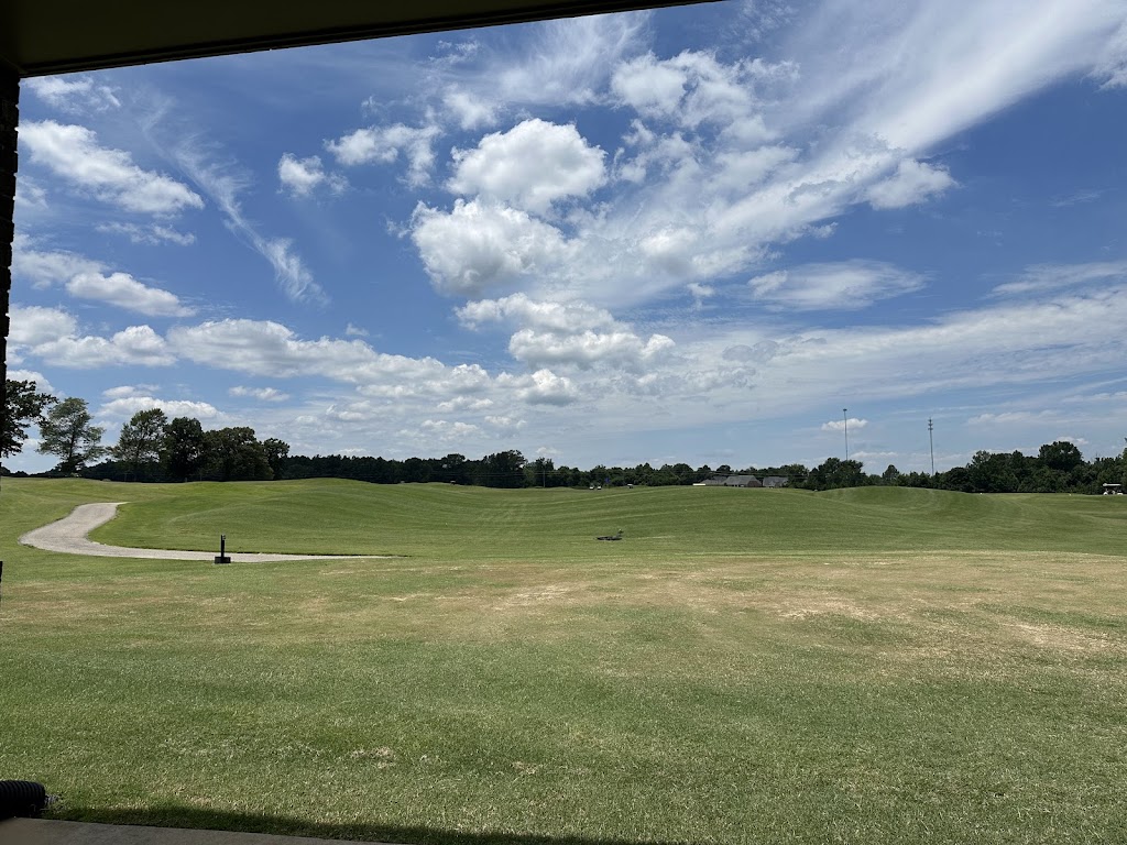 Panoramic view of a lush green golf course at Fair Oaks Golf Club. Smooth