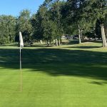 Panoramic view of a lush green golf course at Fairlawn Golf Course. Smooth