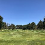 Panoramic view of a lush green golf course at Fairlawn Golf Course. Smooth