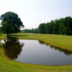 Panoramic view of a lush green golf course at Fairmont Golf Course. Smooth
