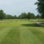 Panoramic view of a lush green golf course at Fairplay Golf Course. Smooth
